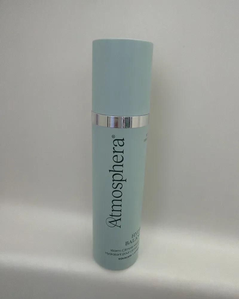 A customer's photo: a bottle of HYDRA BALANCE™ standing on a white bathroom ledge.